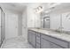 Bathroom featuring double sinks, granite counters, and a glass-enclosed shower with tiled walls at 333 Gardens Of Harmony Dr, Canton, GA 30115