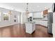 Open concept kitchen with island, stainless appliances, and breakfast nook at 333 Gardens Of Harmony Dr, Canton, GA 30115