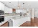 Stylish kitchen with stainless steel appliances, granite countertops, and pendant lighting over the island at 333 Gardens Of Harmony Dr, Canton, GA 30115