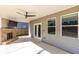 Covered patio featuring a ceiling fan and brick fireplace at 333 Gardens Of Harmony Dr, Canton, GA 30115