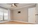 Bedroom with hardwood floors and a large window at 407 Coleraine Se, Smyrna, GA 30080