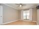 Bright bedroom with hardwood floors and large window at 407 Coleraine Se, Smyrna, GA 30080