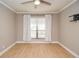 Spacious bedroom with hardwood floors and large window at 407 Coleraine Se, Smyrna, GA 30080