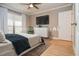 Main bedroom with a king-size bed and neutral decor at 407 Coleraine Se, Smyrna, GA 30080