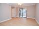 Bedroom with sliding door to patio and wood-look flooring at 407 Coleraine Se, Smyrna, GA 30080