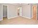 Bright bedroom with wood-look flooring and access to bathroom and closet at 407 Coleraine Se, Smyrna, GA 30080