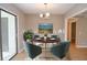 Dining room with hardwood floors, chandelier, and virtually staged furniture at 407 Coleraine Se, Smyrna, GA 30080