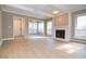 Living room features hardwood floors, fireplace, and sunroom at 407 Coleraine Se, Smyrna, GA 30080