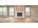 Living room with a fireplace and large windows for natural light at 407 Coleraine Se, Smyrna, GA 30080