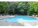 Community swimming pool with plenty of lounge chairs at 407 Coleraine Se, Smyrna, GA 30080