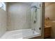 Bathroom featuring a bathtub, shower, and marble tile at 5236 Weatherwood Trce, Marietta, GA 30068