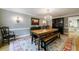 Formal dining room with a wooden table and bench at 5236 Weatherwood Trce, Marietta, GA 30068