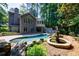 Inviting pool and spa surrounded by lush landscaping at 5236 Weatherwood Trce, Marietta, GA 30068