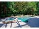 Relaxing pool and spa area with stone accents at 5236 Weatherwood Trce, Marietta, GA 30068