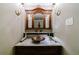 Stylish powder room with marble vanity and copper sink at 5236 Weatherwood Trce, Marietta, GA 30068