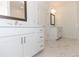 Double vanity bathroom with marble-look tile floors and modern fixtures at 706 Dodd Ln # 157, Buford, GA 30518