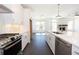 Modern white kitchen with island and stainless steel appliances at 706 Dodd Ln # 157, Buford, GA 30518