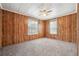 Bright bedroom with wood paneling and carpet at 1265 Glenbrooke Cv, Lawrenceville, GA 30045