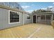 Wooden deck overlooking backyard and screened porch at 1265 Glenbrooke Cv, Lawrenceville, GA 30045