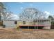 Mobile home exterior with gray siding and wooden deck at 1265 Glenbrooke Cv, Lawrenceville, GA 30045