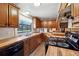 Kitchen boasts ample counter space and wood cabinets at 1265 Glenbrooke Cv, Lawrenceville, GA 30045