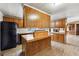 Modern kitchen with black appliances and wood cabinets at 1265 Glenbrooke Cv, Lawrenceville, GA 30045