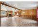 Spacious living room with fireplace and wood paneling at 1265 Glenbrooke Cv, Lawrenceville, GA 30045