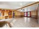 Living room with wood paneling, built-in shelving and fireplace at 1265 Glenbrooke Cv, Lawrenceville, GA 30045