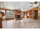 Spacious living room with fireplace and wood paneling at 1265 Glenbrooke Cv, Lawrenceville, GA 30045