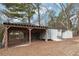 Various storage sheds and covered structure in the backyard at 1265 Glenbrooke Cv, Lawrenceville, GA 30045