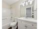 Bathroom features a single sink vanity with modern lighting and a tub with shower at 2320 Whitestone Pl, Alpharetta, GA 30005