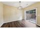 Dining area with modern chandelier and sliding glass doors leading to the outside at 2320 Whitestone Pl, Alpharetta, GA 30005