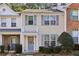 Charming townhome with a quaint front porch and manicured shrubs at 2320 Whitestone Pl, Alpharetta, GA 30005