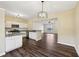 Bright kitchen with white cabinets opens to a well-lit adjacent room at 2320 Whitestone Pl, Alpharetta, GA 30005