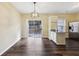 Kitchen area with white cabinets and stainless refrigerator with sliding glass doors at 2320 Whitestone Pl, Alpharetta, GA 30005