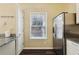 Kitchen area featuring stainless steel refrigerator and granite counters at 2320 Whitestone Pl, Alpharetta, GA 30005