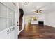 Hardwood floors lead to fireplace, staircase and front door in this bright living room at 2320 Whitestone Pl, Alpharetta, GA 30005