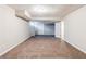 Spacious finished basement with plush carpet and white trim offers versatility for recreation or relaxation at 250 Hermer Nw Cir, Atlanta, GA 30311