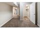 Open basement area with doors leading to other rooms, featuring carpet and vinyl flooring at 250 Hermer Nw Cir, Atlanta, GA 30311