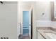 Well-lit bathroom with tiled shower, granite counters, and modern fixtures at 250 Hermer Nw Cir, Atlanta, GA 30311