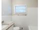 Bright bathroom with white tile, granite countertops, and a window for natural light at 250 Hermer Nw Cir, Atlanta, GA 30311