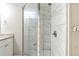 Renovated bathroom with tiled shower, glass door and granite countertop offers a modern touch at 250 Hermer Nw Cir, Atlanta, GA 30311