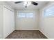 Spacious bedroom featuring a ceiling fan, neutral walls, and a large window at 250 Hermer Nw Cir, Atlanta, GA 30311