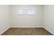 Cozy bedroom featuring neutral walls, plush carpeting, and a bright window at 250 Hermer Nw Cir, Atlanta, GA 30311