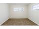 Bedroom with neutral color scheme, large windows, and plush carpeting at 250 Hermer Nw Cir, Atlanta, GA 30311