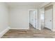 Living room with new floors, neutral walls, and a view into the hall at 250 Hermer Nw Cir, Atlanta, GA 30311