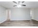 Large living room with new floors, ceiling fan, and neutral wall paint at 250 Hermer Nw Cir, Atlanta, GA 30311