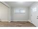 Entryway to living room with new wood-look flooring, bright window, and neutral paint at 250 Hermer Nw Cir, Atlanta, GA 30311