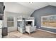 Bedroom with carpeted floor, bunk beds, grey accent wall, and lots of natural light from windows at 2625 Lake Erma Dr, Hampton, GA 30228