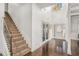 Grand foyer featuring hardwood floors, a staircase with iron railings, and high ceilings at 2625 Lake Erma Dr, Hampton, GA 30228